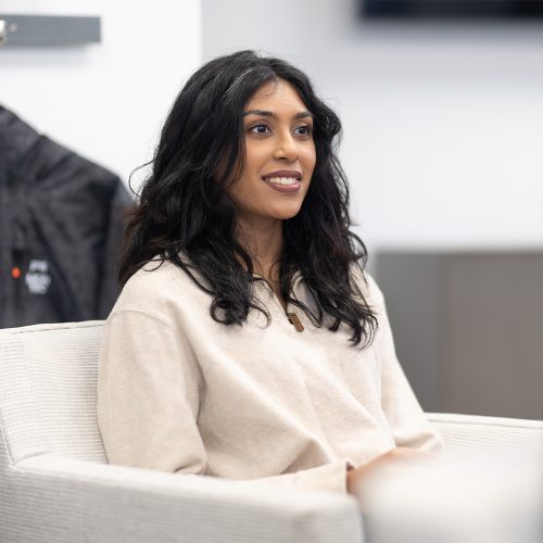 Woman sitting at the table and smiling at the office