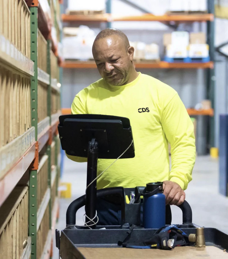 CDS employee working in the warehouse