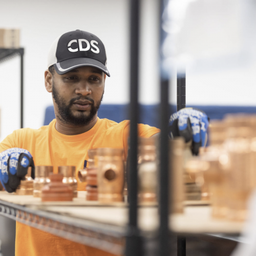 CDS employee working with equipment pieces